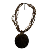 Handcrafted Six Strand Brown Beaded Necklace With Abalone Inlay Round Pendant